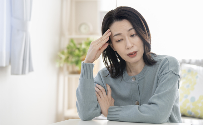 体調不良に悩む女性