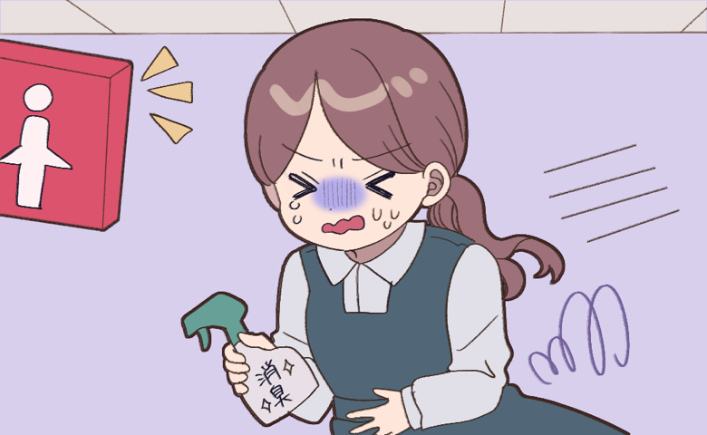 お腹を押さえながら慌ててトイレへ駆け込む女性。顔は青ざめ、冷や汗を流している。手には「消臭」と書かれたスプレーを握りしめ、切羽詰まった様子が伝わるイラスト。